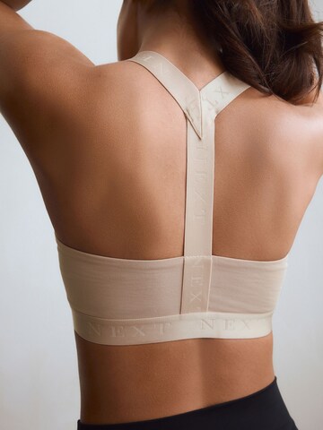 Bustino Reggiseno sportivo di Next in beige