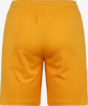 NIKE Regular Workout Pants in Orange