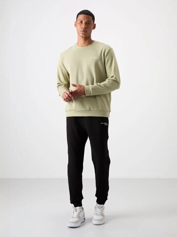 Tommy Life Trainingspak 'Aktive Sets' in Zwart: voorkant