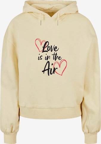 Merchcode Sweatshirt 'Valentines Day - Love is in the Air' in Geel: voorkant