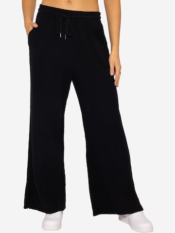 SASSYCLASSY Loose fit Trousers in Black: front