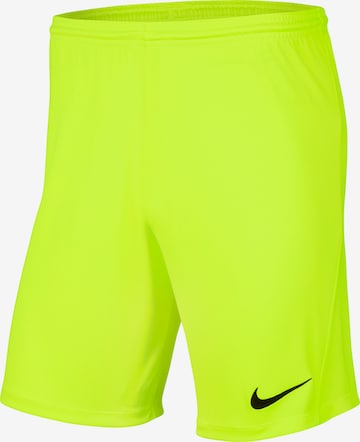 NIKE Workout Pants in Yellow: front