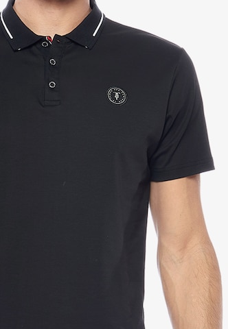 Le Temps Des Cerises Poloshirt 'ARON' in Schwarz