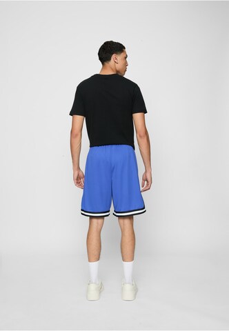 Karl Kani - Loosefit Calças 'Essential' em azul