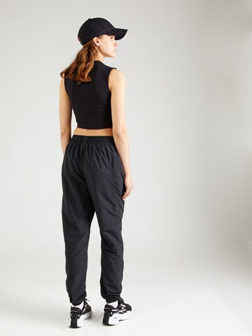 Reebok Tapered Trousers in Black