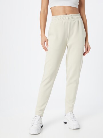 Tapered Pantaloni sportivi di Athlecia in beige: frontale