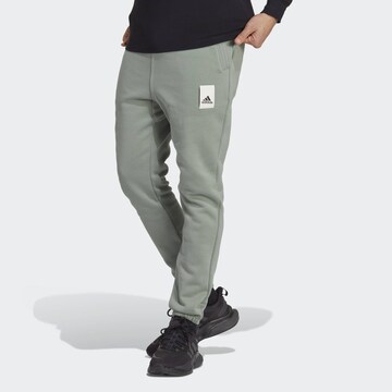 ADIDAS SPORTSWEAR Tapered Workout Pants 'Lounge Fleece' in Green: front