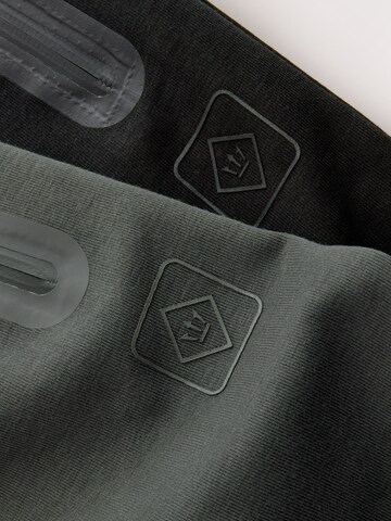 Tapered Pantaloni di Next in grigio