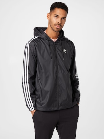 ADIDAS ORIGINALS - Chaqueta de entretiempo en negro: frente