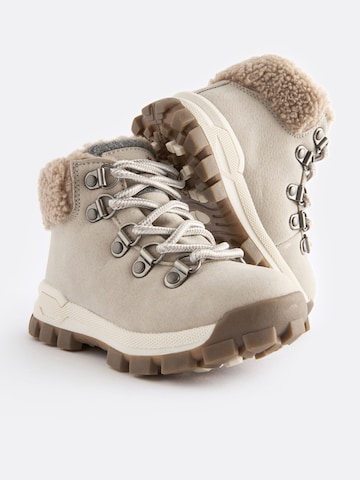 Bottes Next en beige