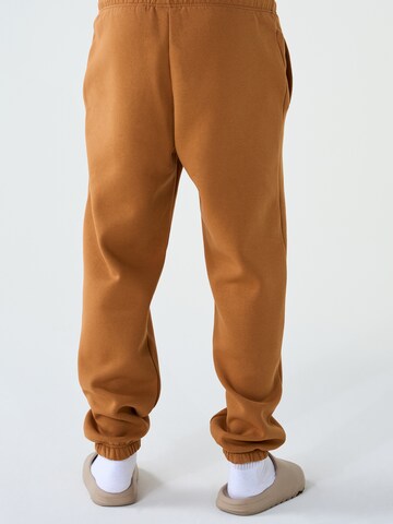 ABOUT YOU x Dardan Loose fit Trousers 'Marlo' in Brown