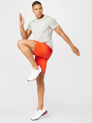 PUMA Regular Workout Pants in Orange