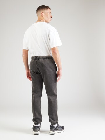 Tapered Pantaloni di Champion Authentic Athletic Apparel in nero