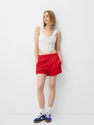 Bershka Szabványos Nadrág - piros