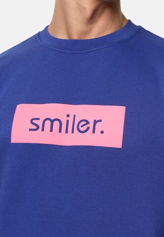 Sweat-shirt smiler. en bleu