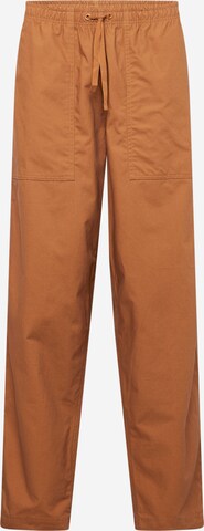 Nike Sportswear Lużny krój Spodnie 'CLUB BARCELONA' w kolorze brązowy: przód