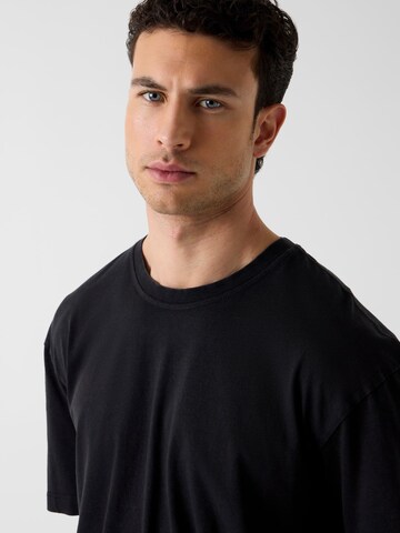 GUESS T-Shirt in Schwarz