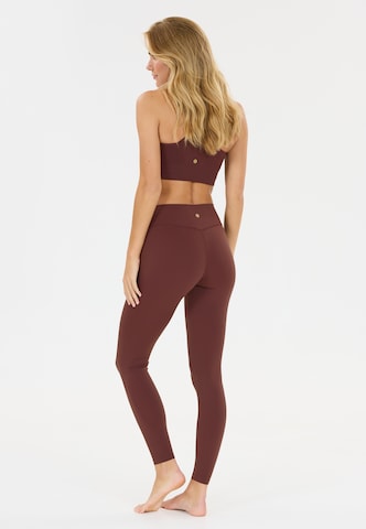 Athlecia Skinny Workout Pants 'Luxe' in Red