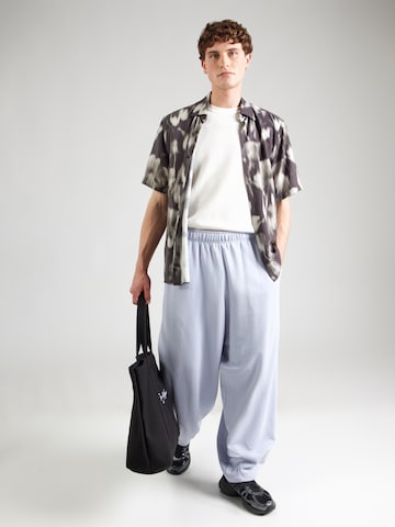 Effilé Pantalon 'CLUB' Nike Sportswear en bleu