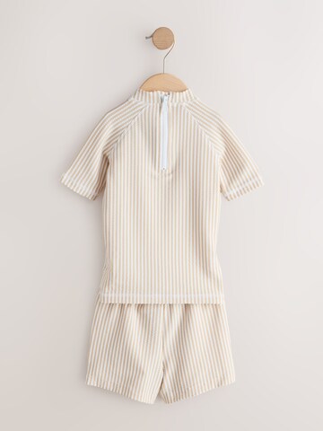 Next - Protección UV en beige