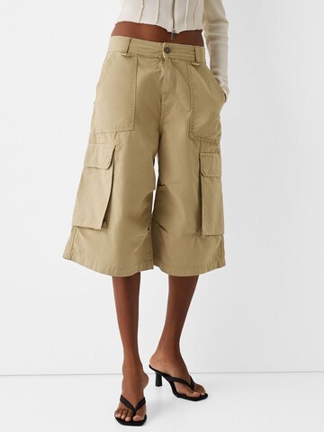 Bershka Wide leg Cargo Pants in Brown: front