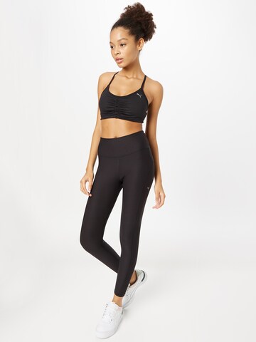 PUMA Skinny Sportbyxa i svart