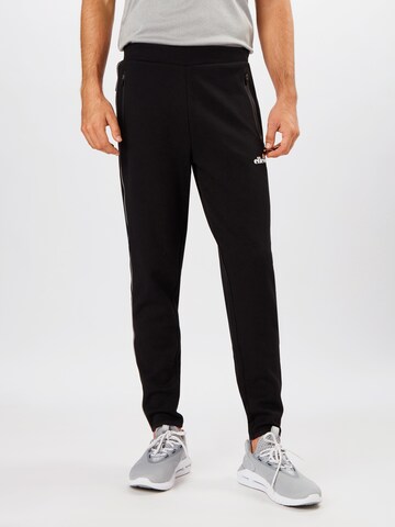 ELLESSE Tapered Workout Pants 'Diruta' in Black: front