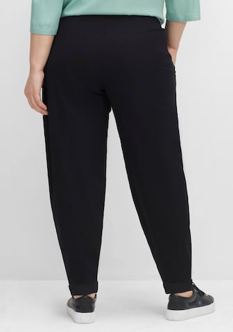 SHEEGO Tapered Pleat-Front Pants in Black