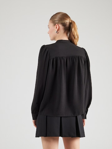 QS - Blusa en negro