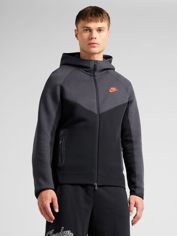 Nike Sportswear Jopa na zadrgo 'TCH FLC' | črna barva: sprednja stran