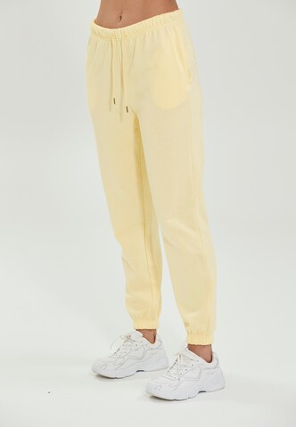 Athlecia Regular Workout Pants 'Soffina' in Yellow: front