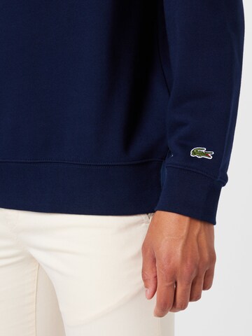 LACOSTE Sweatshirt i blå