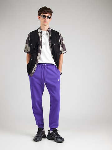Nike Sportswear Tapered Housut 'CLUB' värissä lila