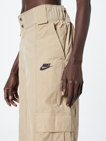 Wide leg Pantaloni cu buzunare de la Nike Sportswear pe verde