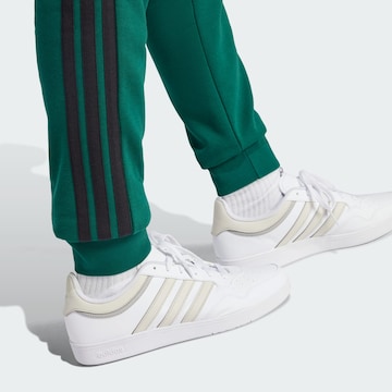 ADIDAS SPORTSWEAR Tapered Sports trousers 'Essential' in Green