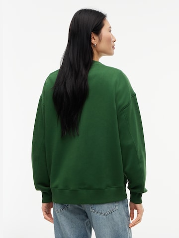 TOMMY HILFIGER Sweatshirt 'VARSITY' in Grün
