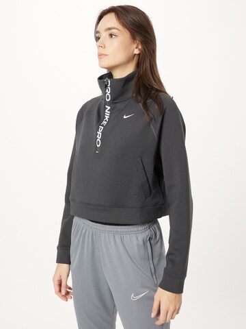 NIKE - Sweatshirt de desporto em cinzento: frente