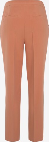 LASCANA Slim fit Trousers with creases in Orange