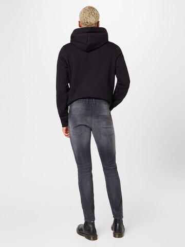 Skinny Jeans 'KROOLEY' di DIESEL in grigio