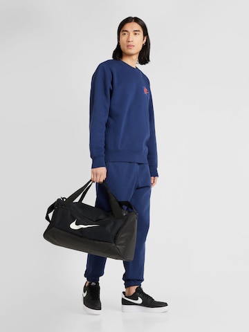 Nike Sportswear - Tapered Calças 'CLUB' em azul