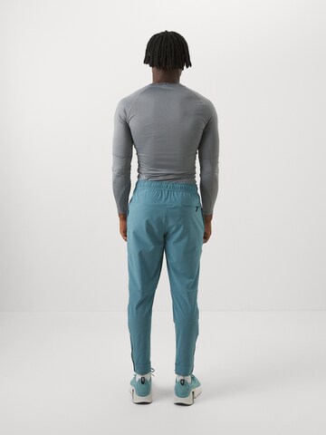 NIKEregular Sportske hlače 'UNLIMITED' - plava boja