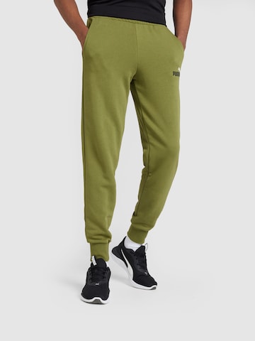 PUMA Tapered Sports trousers 'ESS+' in Green: front