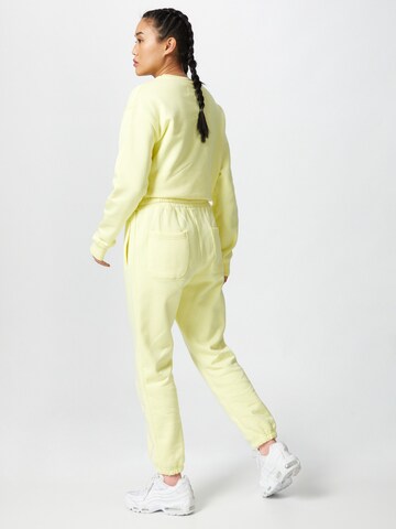 ABOUT YOU x Mero Loose fit Trousers 'Code' in Yellow