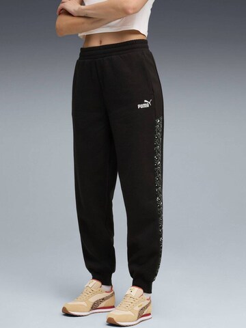 PUMA - Tapered Pantalón deportivo 'Puma Ess Graphic Animal Comfort High-waist Sweatpants' en negro
