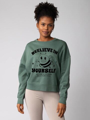 Felpa 'Beelieve in yourself ' di Watapparel in verde: frontale