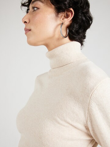 Pull-over Sisley en beige