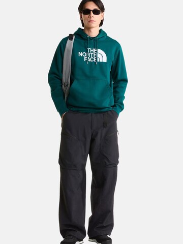 THE NORTH FACE Bluzka sportowa 'THE NORTH FACE M ESS DP REG HODDIE FELPA' w kolorze zielony