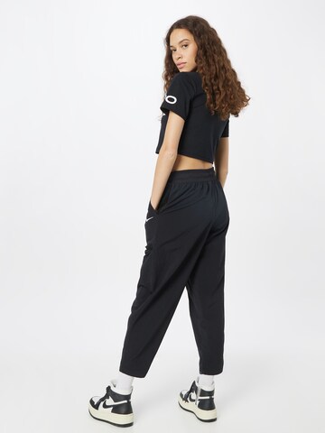 Tapered Pantaloni de la Nike Sportswear pe negru