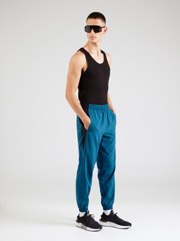 Effilé Pantalon de sport Reebok en bleu