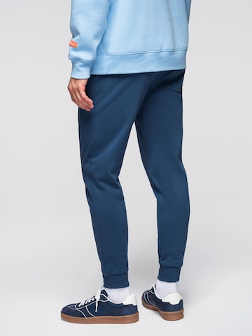 Effilé Pantalon de sport Ombre en bleu